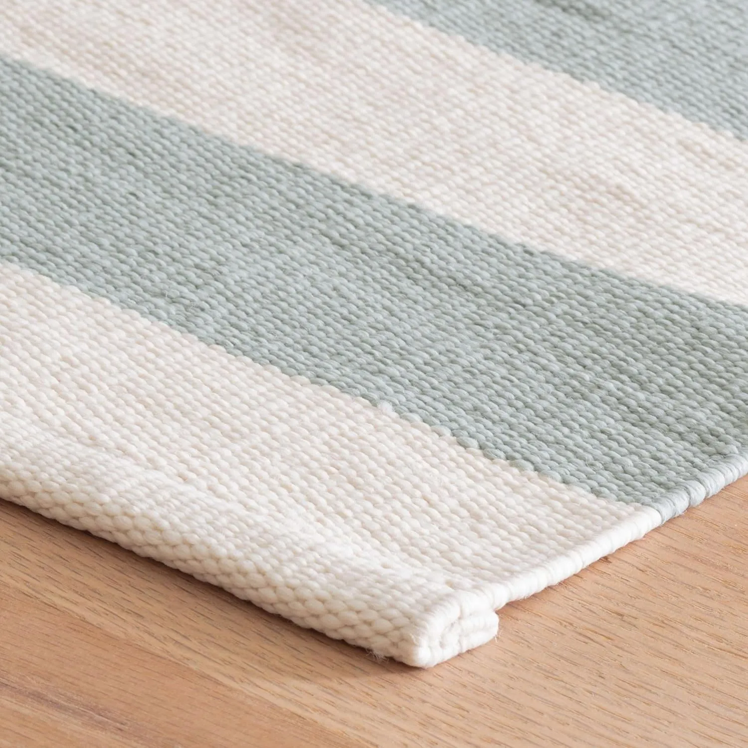 Dash and Albert Catamaran Indoor/Outdoor Area Rug - 6' x 9' Light Blue & Ivory Stripe Handwoven Washable Accent Rug - Fade Resistant, High Traffic Friendly